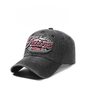 Close-up of RICA JEANS embroidered patch on vintage washed dark gray baseball cap