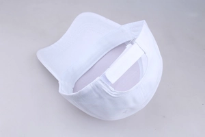 Detailed view of white baseball cap interior with adjustable buckle strap fastener