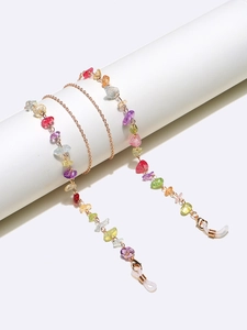 Detail of colorful natural stone chain with gold lobster clasp and silicone loops