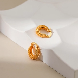 18K gold plated hoop earrings with textured diamond pattern on minimalist white stand