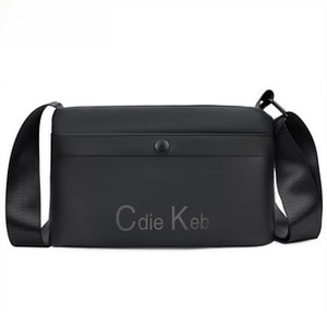 Detail of minimalist black crossbody bag showing matte finish and adjustable strap