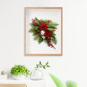 Modern light wood 3D frame featuring festive red floral and pine cone art display