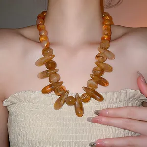 Bohemian amber beaded necklace featuring irregular resin stones for summer vacation style