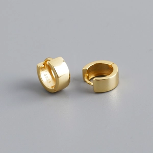 Detail shot of the S925 sterling silver hallmark inside the golden hoop earring