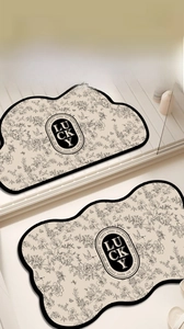 Detail of a cloud-shaped bath mat with vintage floral patterns and Lucky logo