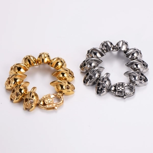 Gothic skull link bracelets shown in gold and silver finish with detailed metallic texture
