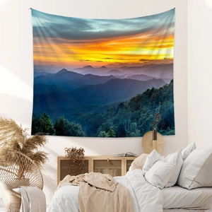 Bohemian wall tapestry featuring sunset mountain landscape and golden forest scenery