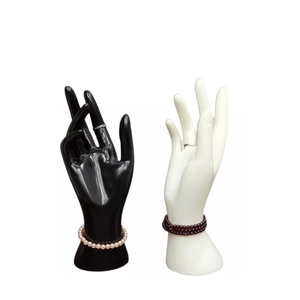Black and white hand model displays for jewelry rings bracelets and pearl necklaces