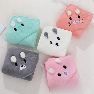 Detail of soft coral fleece hooded baby towels featuring cute 3D animal ears and embroidery