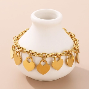 Detailed view of polished 18K gold-plated stainless steel chain with heart charms