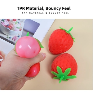 Detailed macro view showing soft TPR material texture of strawberry squeeze toy