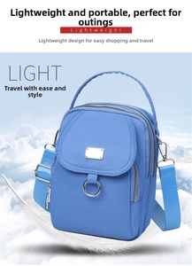 Sky blue lightweight nylon crossbody bag featuring triple-layer zippers and a silver metal plate