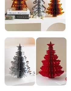 Detailed view of honeycomb paper Christmas trees with serrated edges and star toppers