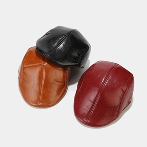 Classic PU leather ivy hats in black, brown, and red colors with vintage stitching