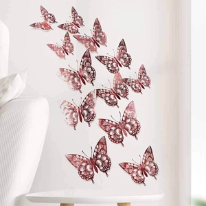 Set of 12 rose gold hollow paper butterfly wall stickers in various sizes for DIY decor