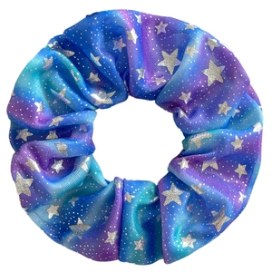 Detail of blue-purple gradient scrunchie with silver star patterns and shiny satin texture