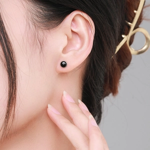 Minimalist S925 sterling silver black agate stud earrings on female model ear
