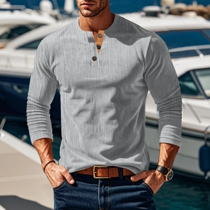 Close-up of grey ribbed knit long sleeve Henley shirt featuring three buttons on a yacht