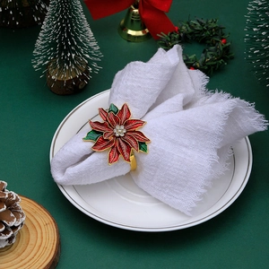 Sparkling rhinestone Christmas tree napkin ring on a festive holiday dinner table setting