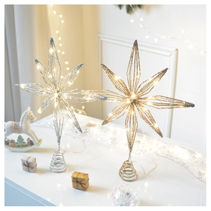 Detail of LED lighted iron star Christmas tree topper with glitter hollow-out design