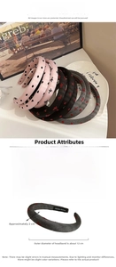 Detail of a padded polka dot headband showing fabric texture and 2cm width dimension