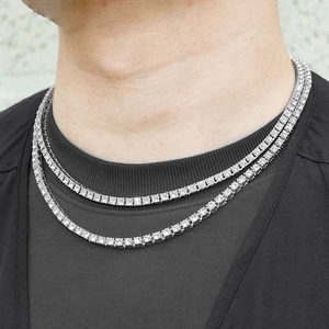 Detail of silver tennis chain necklace set with sparkling round zircons in hip hop style