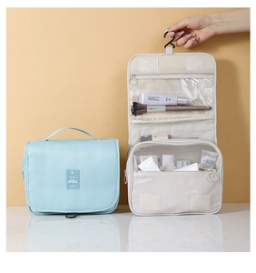 Hanging toiletry bag with multiple compartments and hook for organized travel storage
