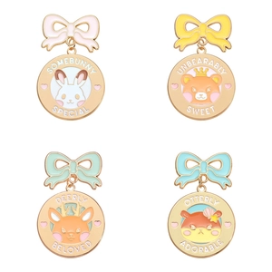 Set of four colorful cartoon animal enamel pins with sweet ribbon and bow designs