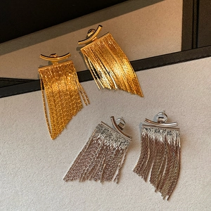 Elegant gold and silver curved bar earrings with long metal tassel fringe charms