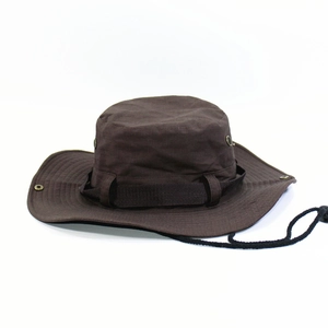 Detail of dark brown boonie hat with ventilation eyelets and adjustable chin strap