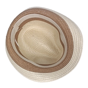 Detail view of the interior woven texture and two-tone contrast of the summer straw hat