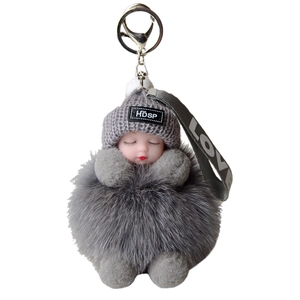 Cute sleeping baby doll keychain with dark grey fox fur pompom and love ribbon decoration