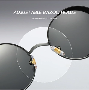 Detail of adjustable nose pads and metal bridge on retro round punk polarized sunglasses