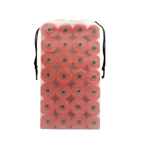 Detailed view of 28 red biodegradable pet waste bags inside a frosted drawstring bag