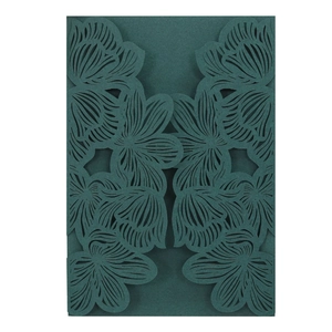 Deep green laser-cut floral wedding invitation card with intricate hollowed patterns
