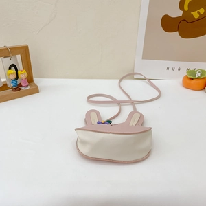Pink and white cartoon bunny purse for kids shown in a cute lifestyle nursery setting