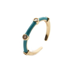 Detail of adjustable gold-plated ring with teal enamel sections and three sparkling zircons