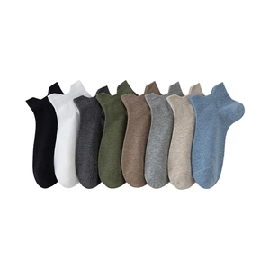 Eight colors of solid cotton ankle socks for men displayed on a clean white background
