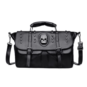 Punk style black leather crossbody bag with silver skull badge and metal rivets