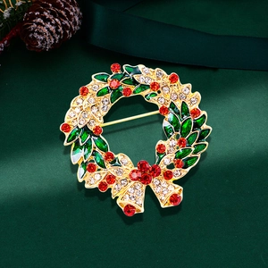 Christmas wreath brooch with green enamel leaves, red crystals and golden bow