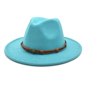 Detail of sky blue fedora hat with brown braided leather band and antique metal buckle