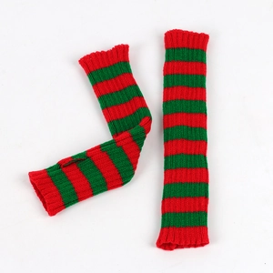 Close-up of knit arm warmers with classic red and green stripes and thumb hole detail