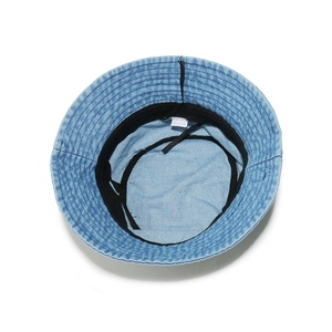 Detail of light blue denim bucket hat interior with sweatband and adjustable drawstring