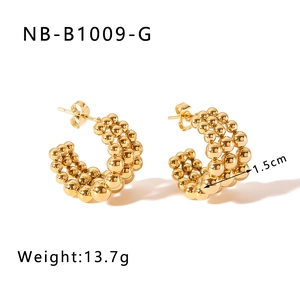 Detail showing 18k gold plated beaded C-shape earrings with 1.5cm diameter and 13.7g weight