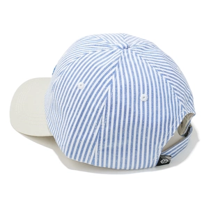 Detail of adjustable metal buckle and blue striped fabric on the baseball cap