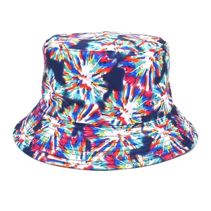 Detail of colorful tie-dye bucket hat with vibrant red, blue and yellow sunburst pattern