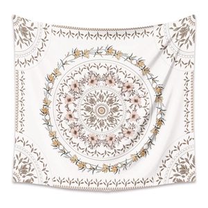 Bohemian mandala tapestry with floral patterns for wall decor hanging on white background