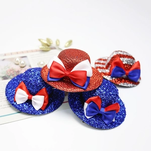 Detailed view of mini Independence Day top hats with red white and blue glitter stripes