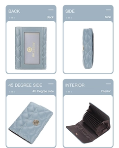 Detail view of light blue quilted leather wallet with accordion slots and photo window