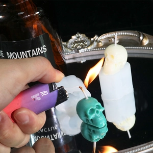 DIY skull candle silicone mold with finished handmade candles and lighting scene
